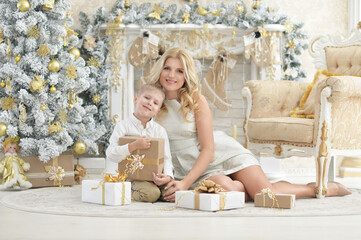 Portrait of beautiful young woman with son posing