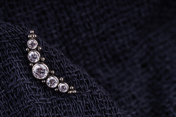 Beautiful piercing jewelry. Macro shot. Selective focus.