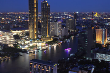 Fototapeta na wymiar The Cityscape, the Skyscraper and the Chao Phraya River of Bangkok Thailand in the Night