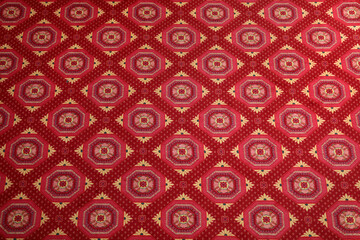 Large red carpet with checkered patterns