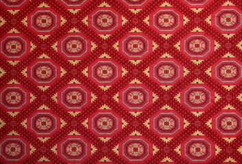 Large red carpet with checkered patterns