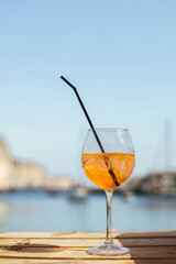 Aperol cocktail by the sea