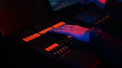 Lighting mixer console on a musical concert or performance. Light engineer working.