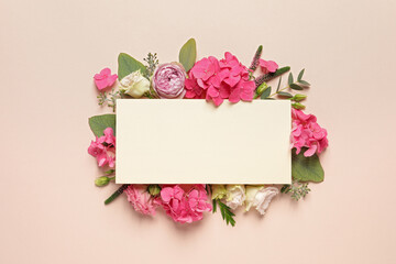 Beautiful composition with hortensia flowers and blank card on beige background, top view. Space...