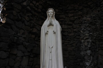 white statue in the catholic church garden