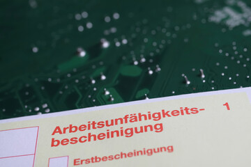 Viersen, Germany - May 9. 2021: Yellow certificate of work incapacity (german:...