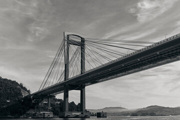 Bridge of Rande in Vigo, Spain, black and white image taken from a boat on the sea