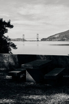 Bench and table made of stone by the ria of Vigo, black and white image