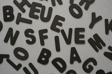 background with black chalk letters on gray paper