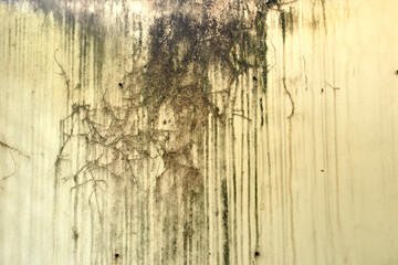 old stain marks of rain flow along with the wall surface.