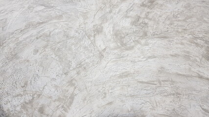 The stains of cement on the polished concrete floor.