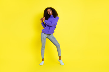 Fototapeta na wymiar Full body portrait of carefree positive dark skin girl partying have fun isolated on yellow color background
