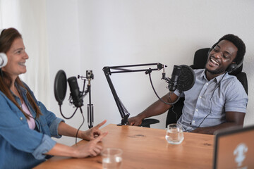 Multiracial people recording podcast inside stuido