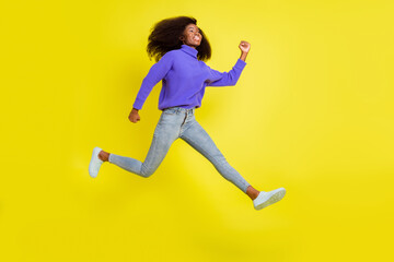 Fototapeta na wymiar Profile photo of funny lady jump fast run wear purple pullover jeans shoes isolated yellow color background