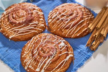 Close up of cinnamon rolls served on a marble table. Do it yourself concept.