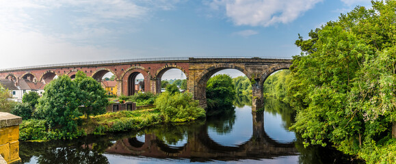 A panorama view from the road bridge towards the railway viaduct at Yarm, Yorkshire, UK in summertime