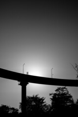 silhouette of a person on a bridge