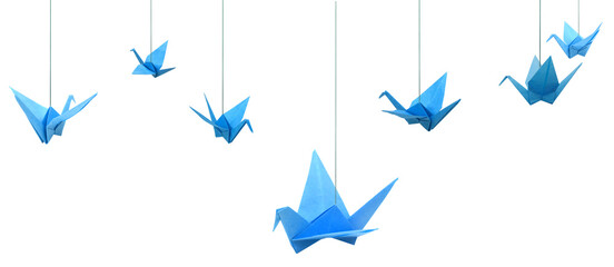 Blue origami paper birds haning isolated white