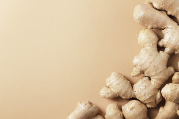Composition of fresh ginger root on the background.