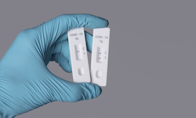 Hand show Coronavirus Covid-19 laboratory self test Quick Antigen Detection Testing fast antibody point of care testing with Positive and negative