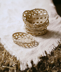 Wicker baskets on white linen tablecloth