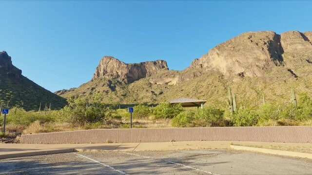 Driving Along The Road Passing By Picacho Peak At Sunny Day In Pinal County, Arizona USA. POV