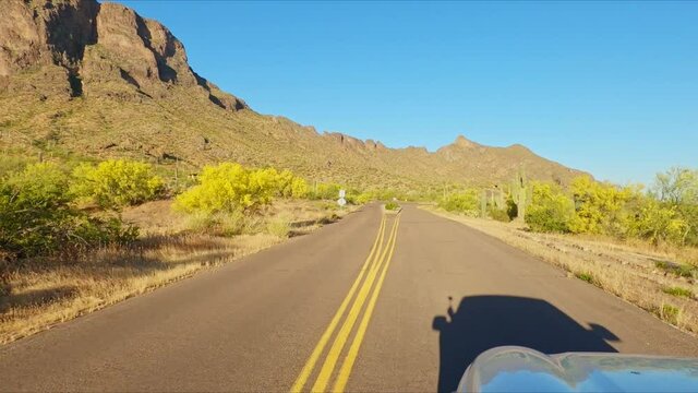 POV Of Car Driving In The Road Towards Picacho Peak State Park On A Sunny Day In Arizona, USA.