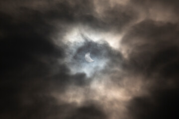 Solar Eclipse dark moody skies sun and moon blue and black stormy 2015