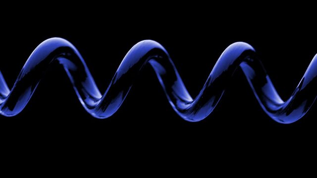  Stretch spring. Spring is compressed and expanded against a black background. Close up.