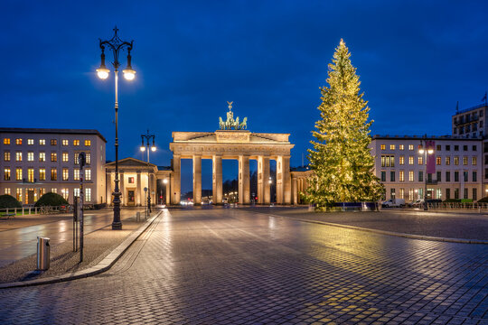 Brandenburg Gate in winter with Christmas tree, Berlin, Germany