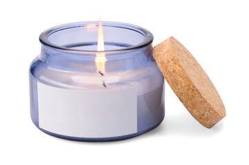 a lit scented new candle in glass on a white insulated background.