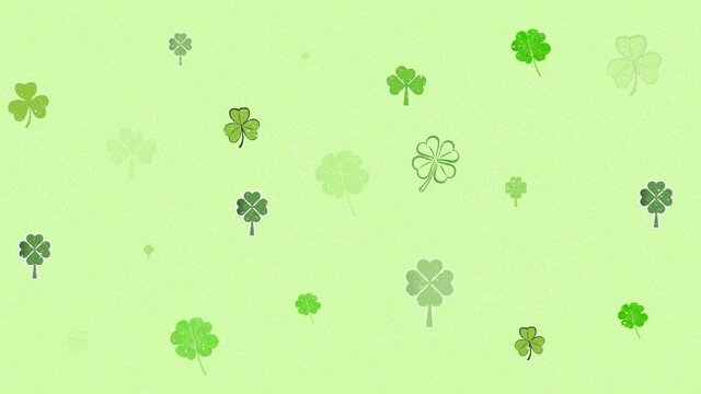 Animation of lucky clover over green background