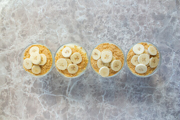 Magnolia banana dessert on the marble table. Top view photo of delicious magnolia dessert.