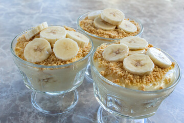 Magnolia banana dessert on the marble table. Closeup photo of delicious magnolia dessert.