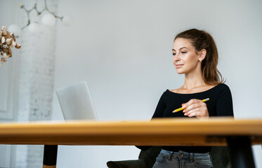 Manager work office in coworking. Designer surf the Internet on a gadget. Portrait of a freelance...