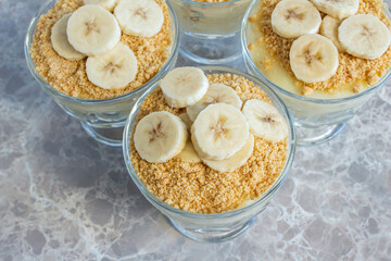 Magnolia banana dessert on the marble table. Closeup photo of delicious magnolia dessert.