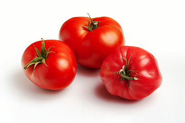 Three large ripe red tomatoes