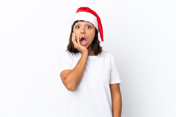 Young mixed race woman celebrating Christmas isolated on white background surprised and shocked while looking right