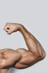 Muscular arm of young bodybuilder