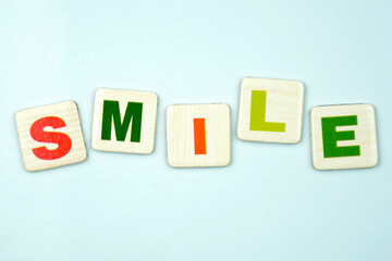 Colorful smile inscription made of squares with letters