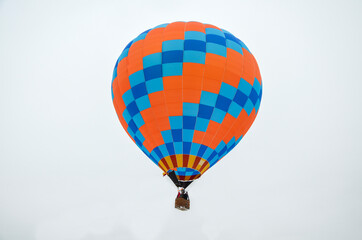 Naklejka premium Colorful multi colored hot air balloons soaring with sky background during aeronautic festival
