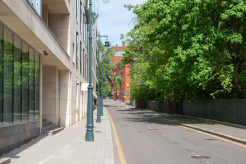 Empty Korobeynikov lane. There are no cars on the highway, no people on the sidewalks