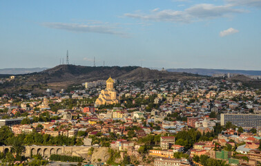 Fototapeta na wymiar Cityscape of Tbilisi, view to old town and The Holy Trinity Cathedral is a prominent landmark. Georgia