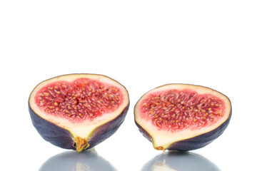 Two half of ripe sweet figs, close-up, isolated on white.