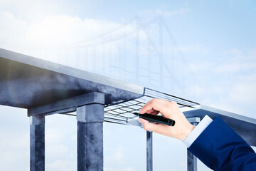 Man drawing picture of bridge, closeup. Business cooperation concept