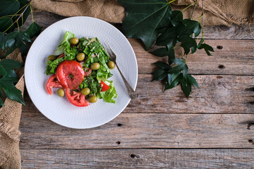 Mixed salad on rustic table