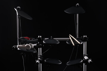 Modern electronic drum kit on dark background. Musical instrument