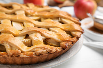 Delicious traditional apple pie on white table, closeup