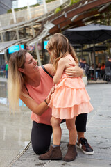 Mother and daughter laugh sincerely. Styling family, true emotions, good day.