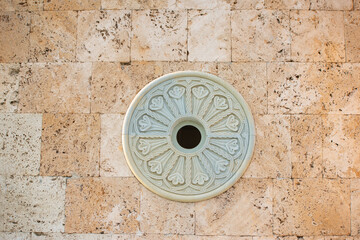plaster rosette with patterns on the wall of a temple in georgia